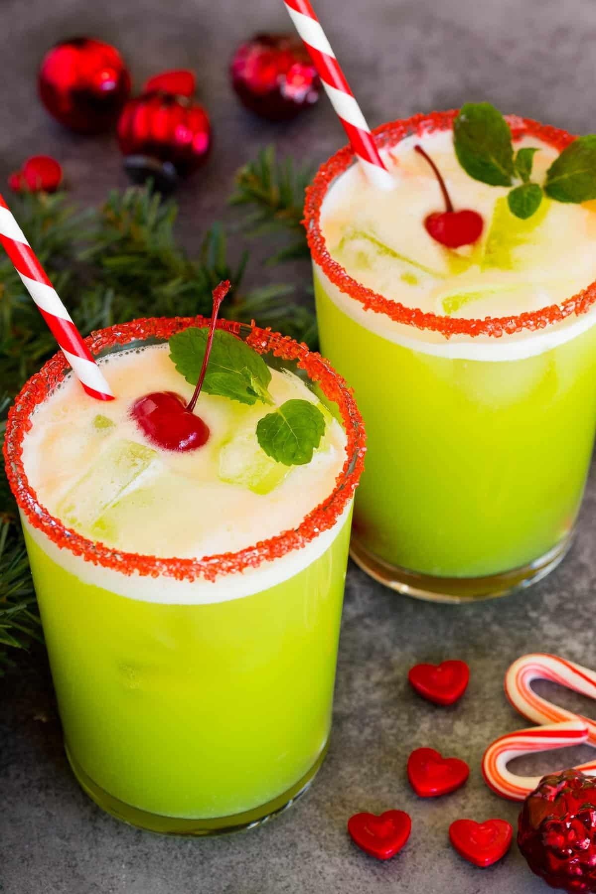 Grinch-Punch 2 Cups of Grinch punch topped with cherries and mint sprigs.