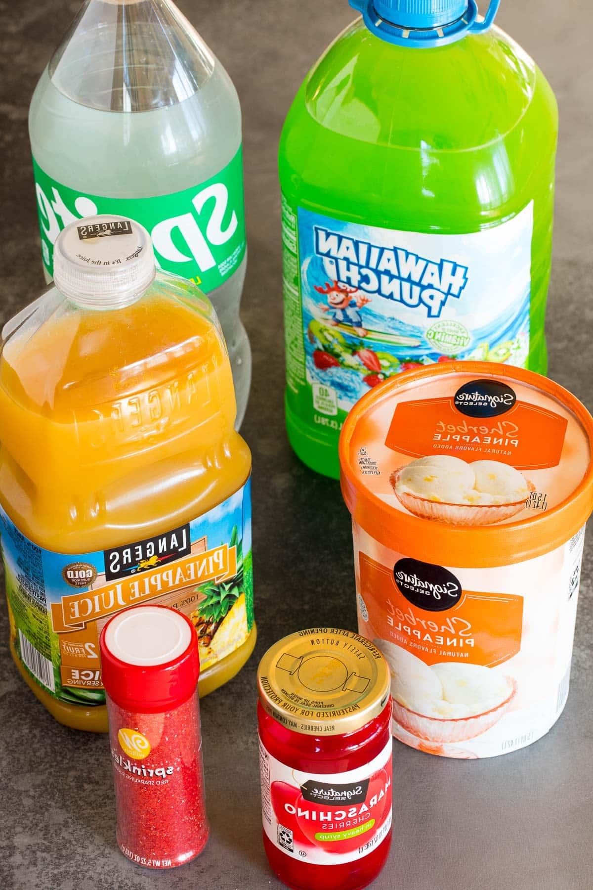 Grinch-Punch 3 Ingredients including bottles of juice, sherbet and lemon lime soda.