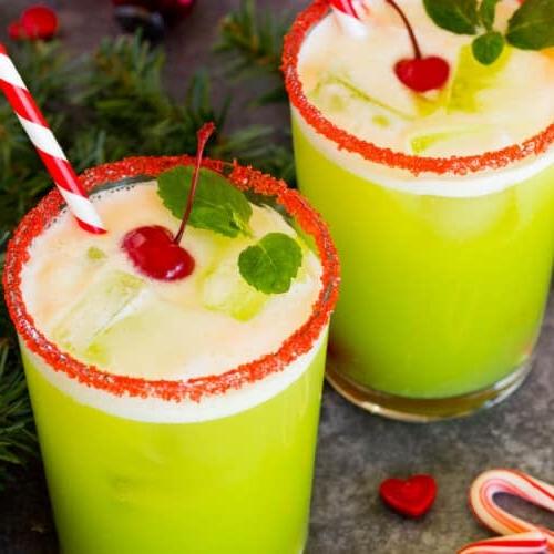 Grinch-Punch 7 Cups of Grinch punch topped with cherries and mint sprigs.