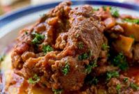 Tender Osso Bucco with a Rich Red Wine Reduction and Creamy Polenta