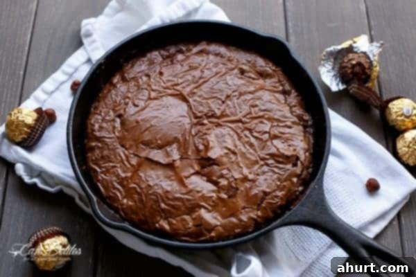 Ultimate Ferrero Rocher Skillet Brookie 9 A Ferrero Rocher Deep Dish Skillet Brownie Cookie, freshly baked and still in the pan, waiting to be served.