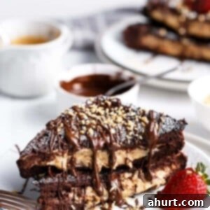 Peanut Butter Cheesecake-Stuffed Chocolate Brownie French Toast 10 Chocolate brownie peanut butter cheesecake stuffed french toasts on a plate