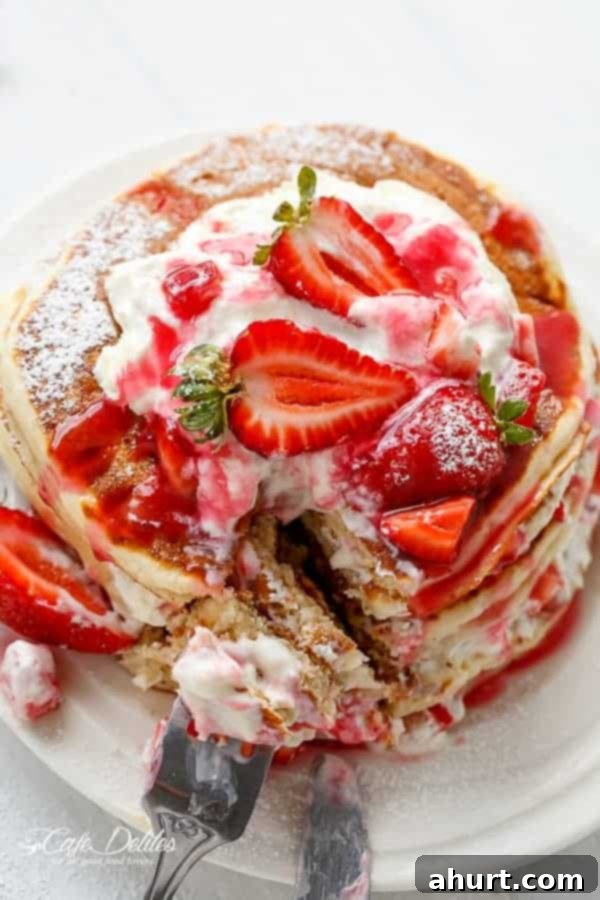 Strawberry Shortcake Pancakes decorated with fresh strawberries