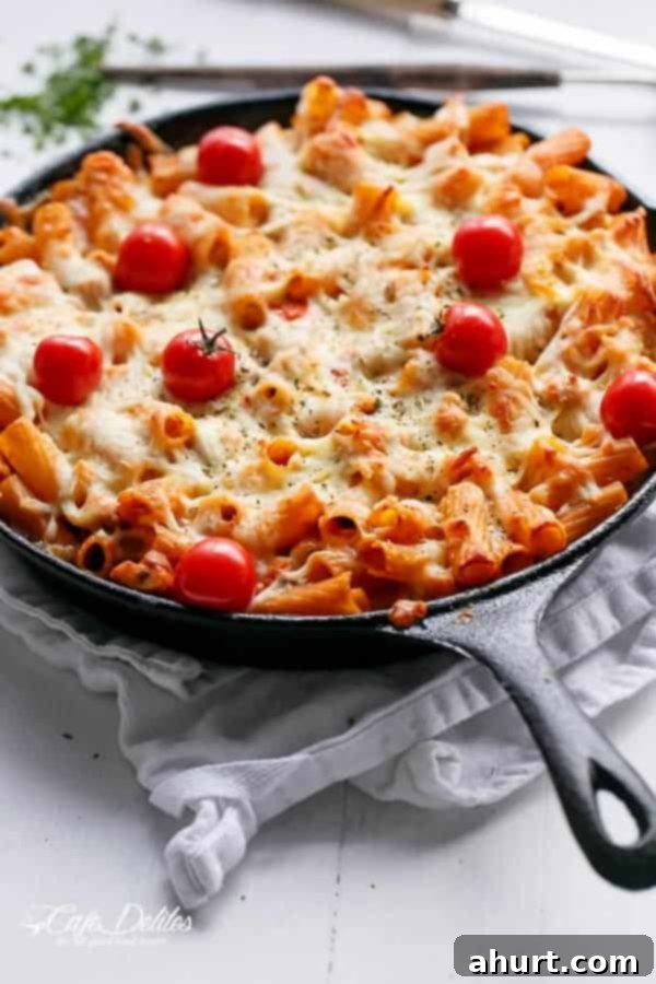 Just baked image of Cheesy Chicken and Roasted Tomato Mozzarella Pasta Bake 