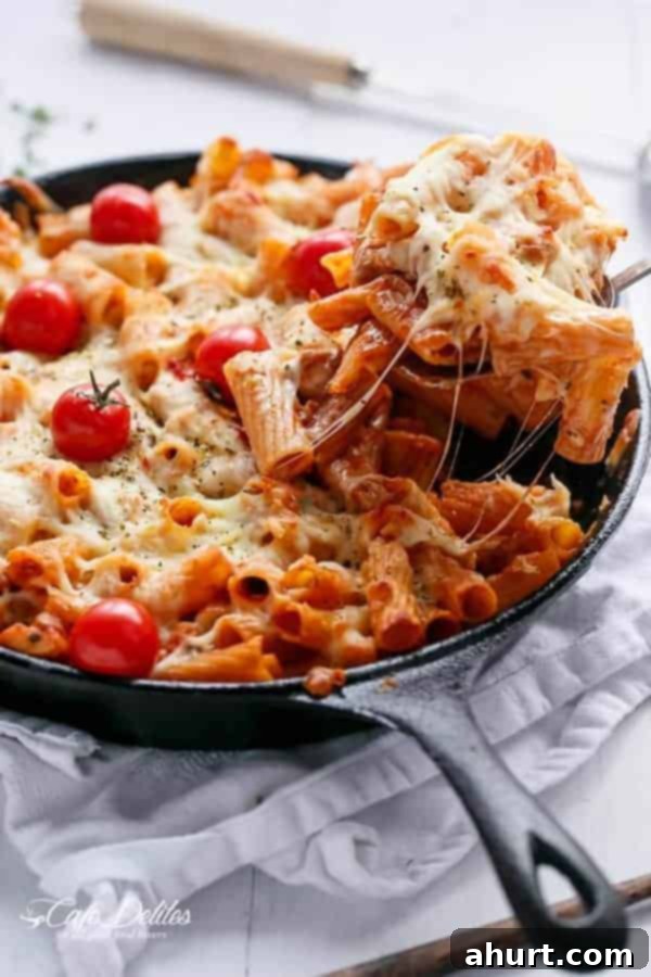 Cheesy Chicken and Roasted Tomato Mozzarella Pasta Bake in a pan
