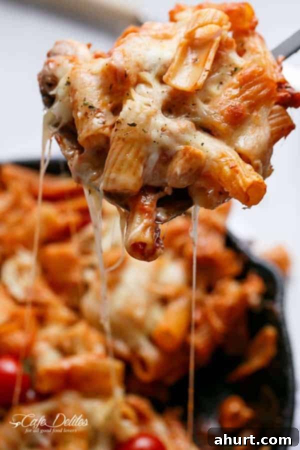 Image focusing on pasta from Cheesy Chicken and Roasted Tomato Mozzarella Pasta Bake 