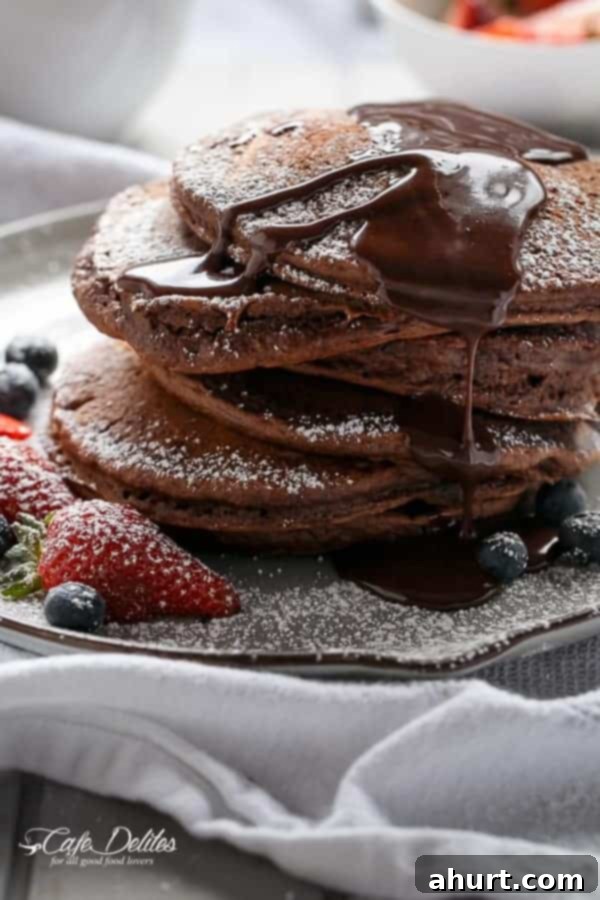 Side view image of tall stack of Double Chocolate Brownie Pancakes