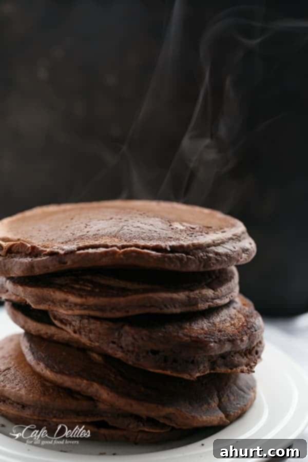 Side view image of a stack of Double Chocolate Brownie Pancakes