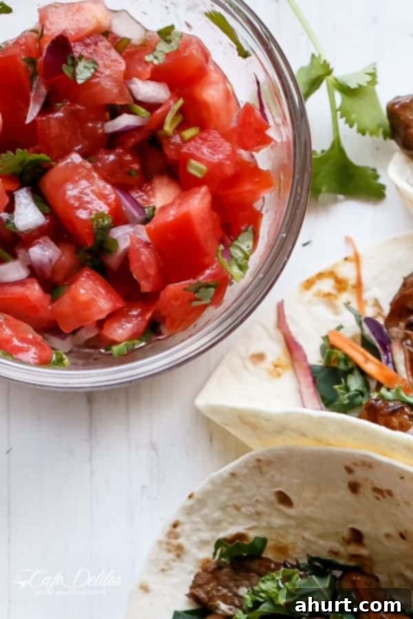 Korean Bulgogi BBQ Beef Tacos alongside a vibrant bowl of Kale Slaw and Pico de Gallo