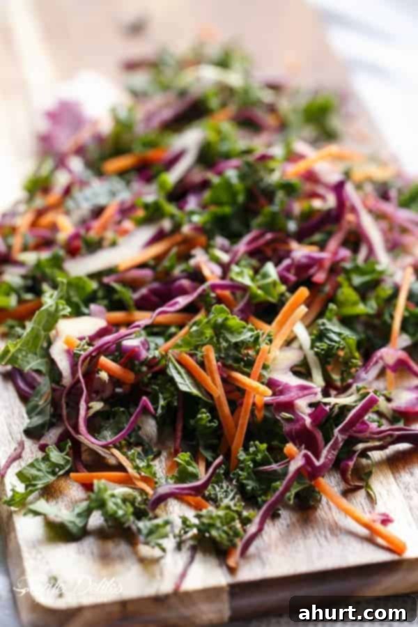 Freshly prepared Kale Slaw and other vibrant vegetables for building Korean Bulgogi Tacos