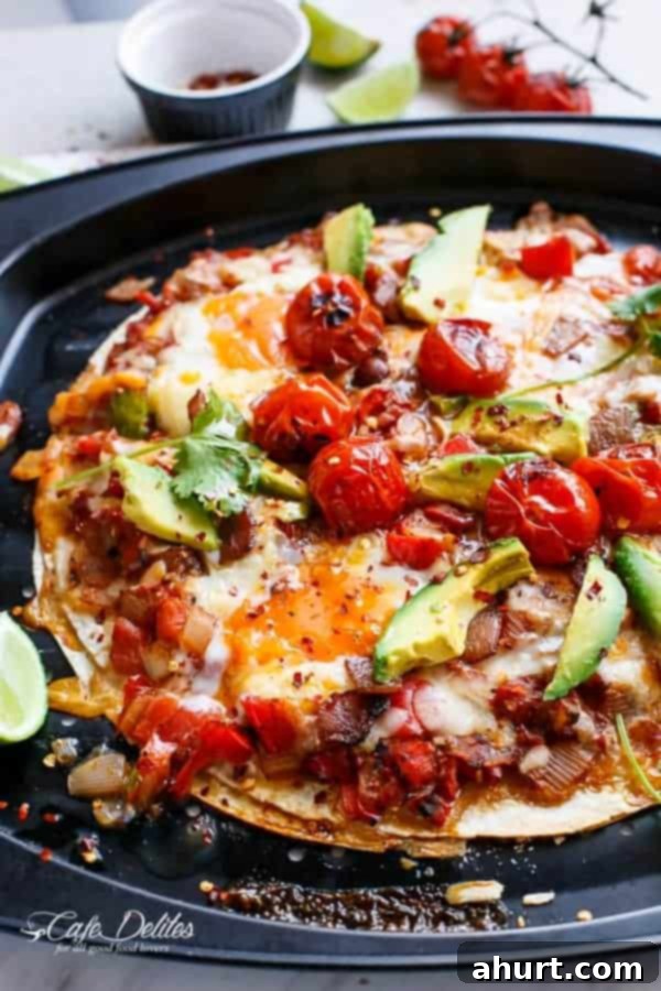 Huevos Rancheros Tortilla Pizza 2 Huevos Rancheros Tortizza on a pan, golden and bubbling