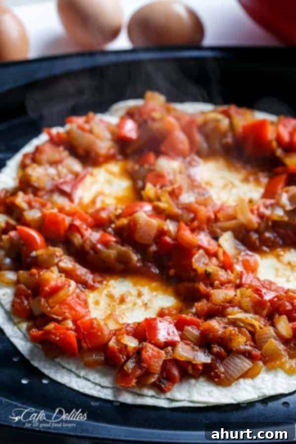 Huevos Rancheros Tortilla Pizza 3 Uncooked Huevos Rancheros Tortizza ready for the oven, showcasing the salsa craters for eggs