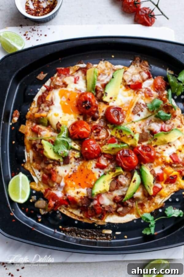 Huevos Rancheros Tortilla Pizza 6 Huevos Rancheros Tortizza (Tortilla Pizza) on a plate, with a close-up of the melted cheese and a hint of runny yolk