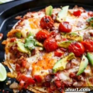 Huevos Rancheros Tortilla Pizza 9 Huevos Rancheros Tortizza on a pan, golden and bubbling