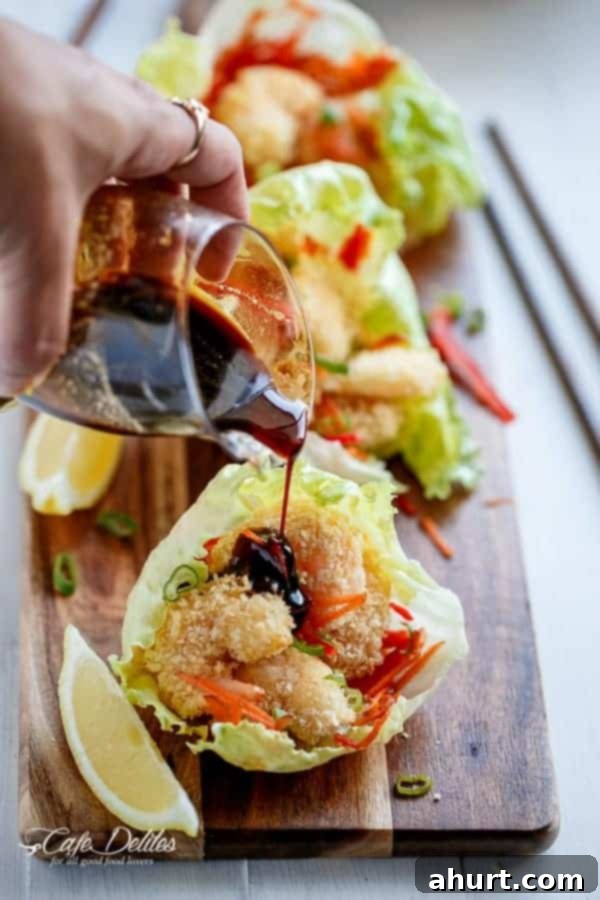 Crispy Oven-Fried Tempura Shrimp Lettuce Wraps with Teriyaki Sauce 4 Teriyaki Sauce drizzled over Oven Fried Tempura Batter Shrimp Lettuce Wraps