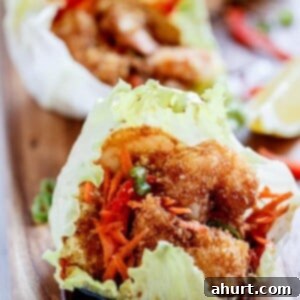 Crispy Oven-Fried Tempura Shrimp Lettuce Wraps with Teriyaki Sauce 6 Oven Fried Tempura Batter Shrimp Lettuce Wraps with a Teriyaki Sauce on a tray