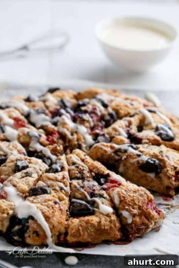 Top view image of Mixed Berry and Chocolate Chunk Buttermilk Scones with a Cream Cheese Glaze