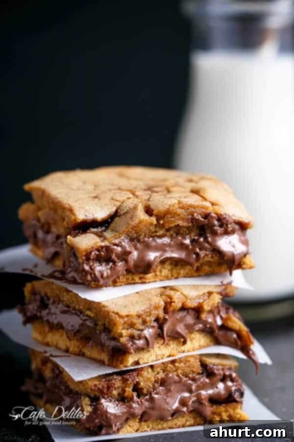 Gooey Nutella Stuffed Salted Caramel Blondies 3 Nutella Stuffed Salted Caramel Blondies pieces on each other