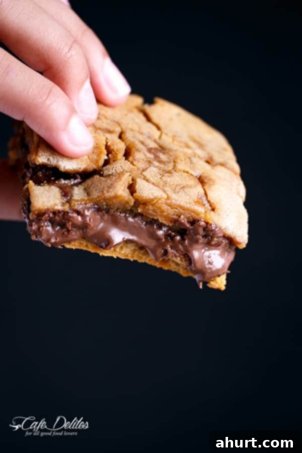 Gooey Nutella Stuffed Salted Caramel Blondies 4 Nutella Stuffed Salted Caramel Blondies piece in hand