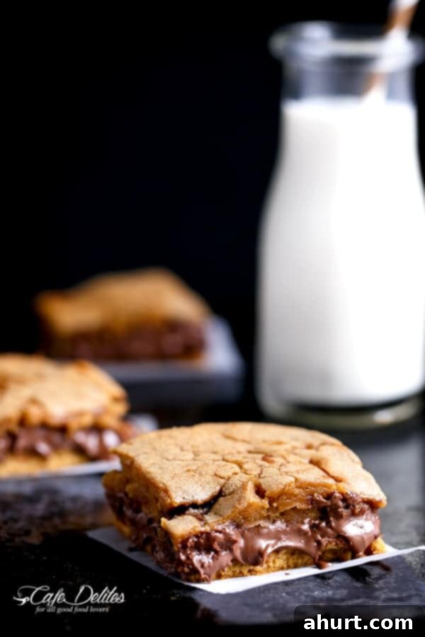 Gooey Nutella Stuffed Salted Caramel Blondies 5 Nutella Stuffed Salted Caramel Blondies pieces