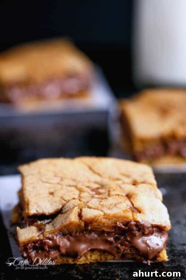 Gooey Nutella Stuffed Salted Caramel Blondies 7 Nutella Stuffed Salted Caramel Blondies pieces