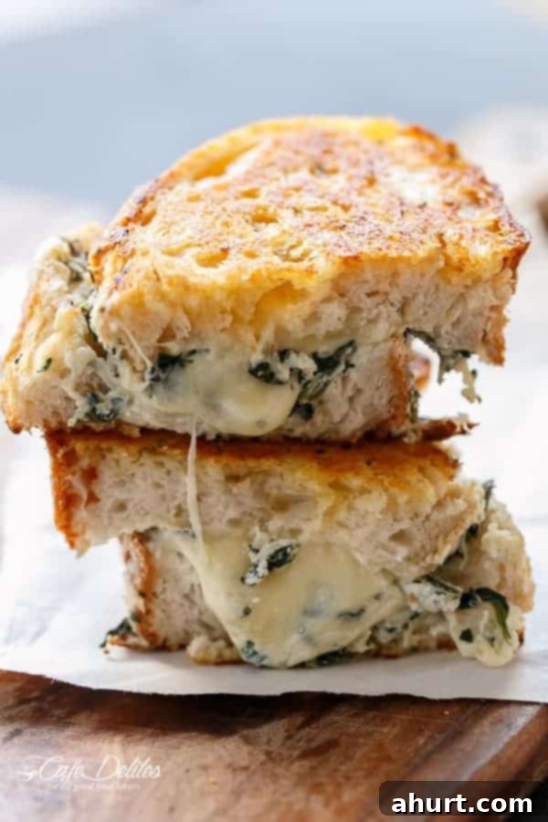 Creamy Spinach and Ricotta Grilled Cheese 2 Side view image of Spinach and Ricotta Grilled Cheese with melted cheese