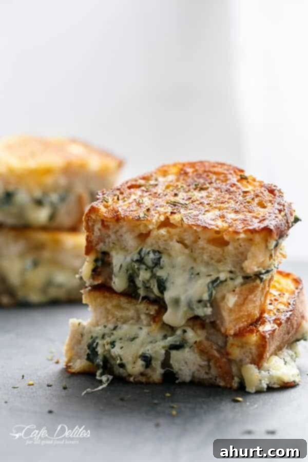 Creamy Spinach and Ricotta Grilled Cheese 7 A single piece of Spinach and Ricotta Grilled Cheese on wax paper