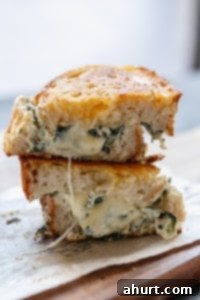 Creamy Spinach and Ricotta Grilled Cheese 9 Spinach and Ricotta Grilled Cheese pieces stacked on each other, ready to eat