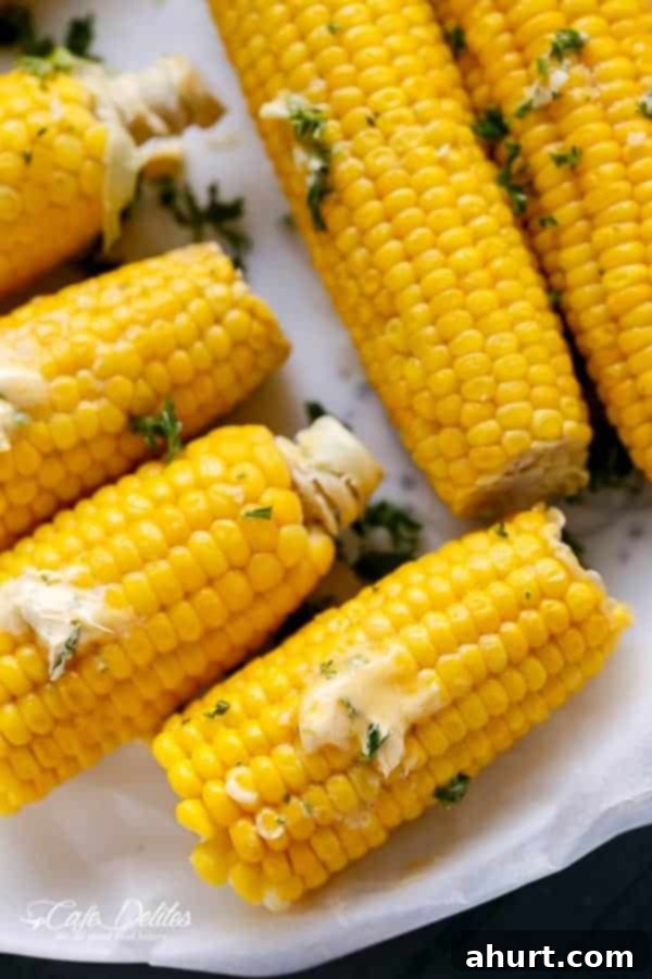 Garlic Butter Glazed Corn 2 Corn On The Cob With Garlic Butter pieces on a tray
