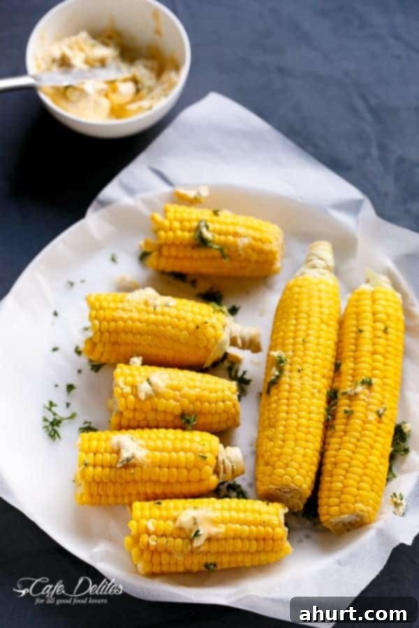 Garlic Butter Glazed Corn 6 Raw corn toped with butter garlic before roasting