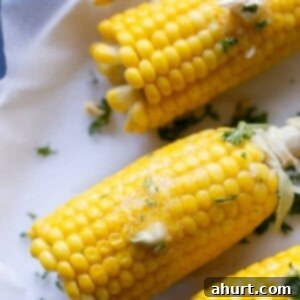 Garlic Butter Glazed Corn 7 Corn On The Cob With Garlic Butter on a tray