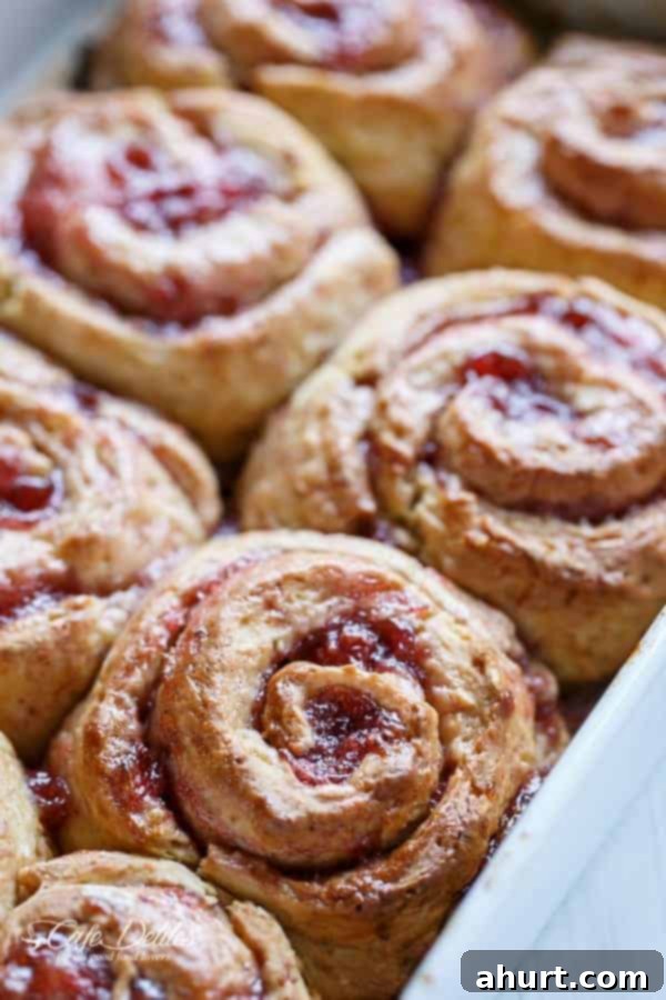 Top view image of freshly baked No Yeast Strawberries And Cream Cinnamon Rolls