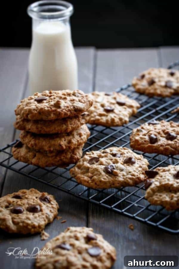 Flourless Oatmeal Peanut Butter Chocolate Chip Cookies stack on each other on a cooling rack  