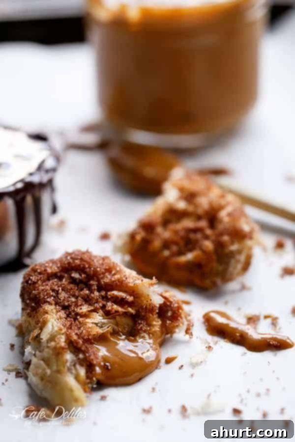Golden Churro Caramel Hand Pies 3 Dulce De Leche Churro Empanadas piece with melting chocolate