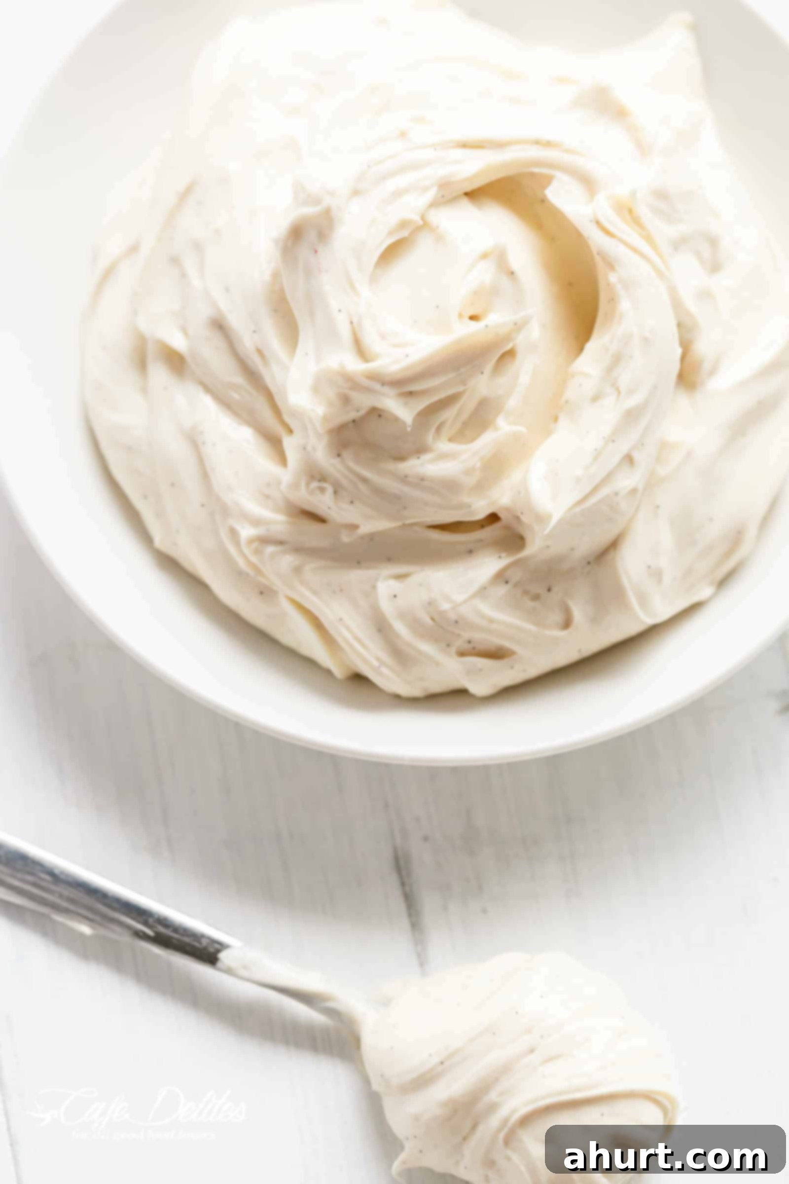 Close-up of the light and whipped Vanilla Bean Cheesecake Filling being prepared
