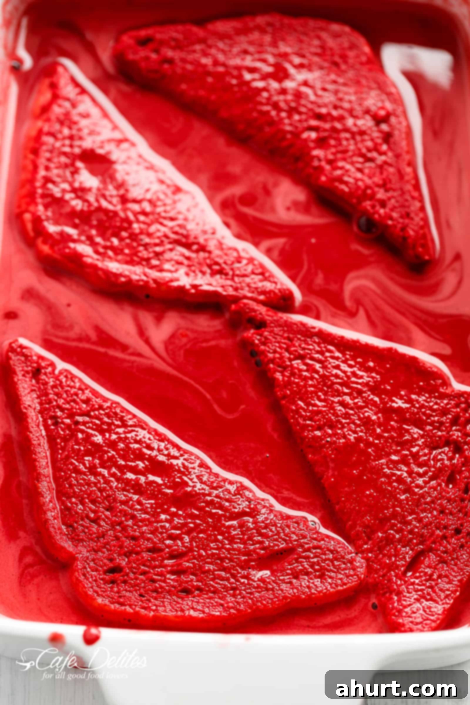 A whole Red Velvet French Toast with Vanilla Bean Cheesecake filling, showcasing its vibrant color