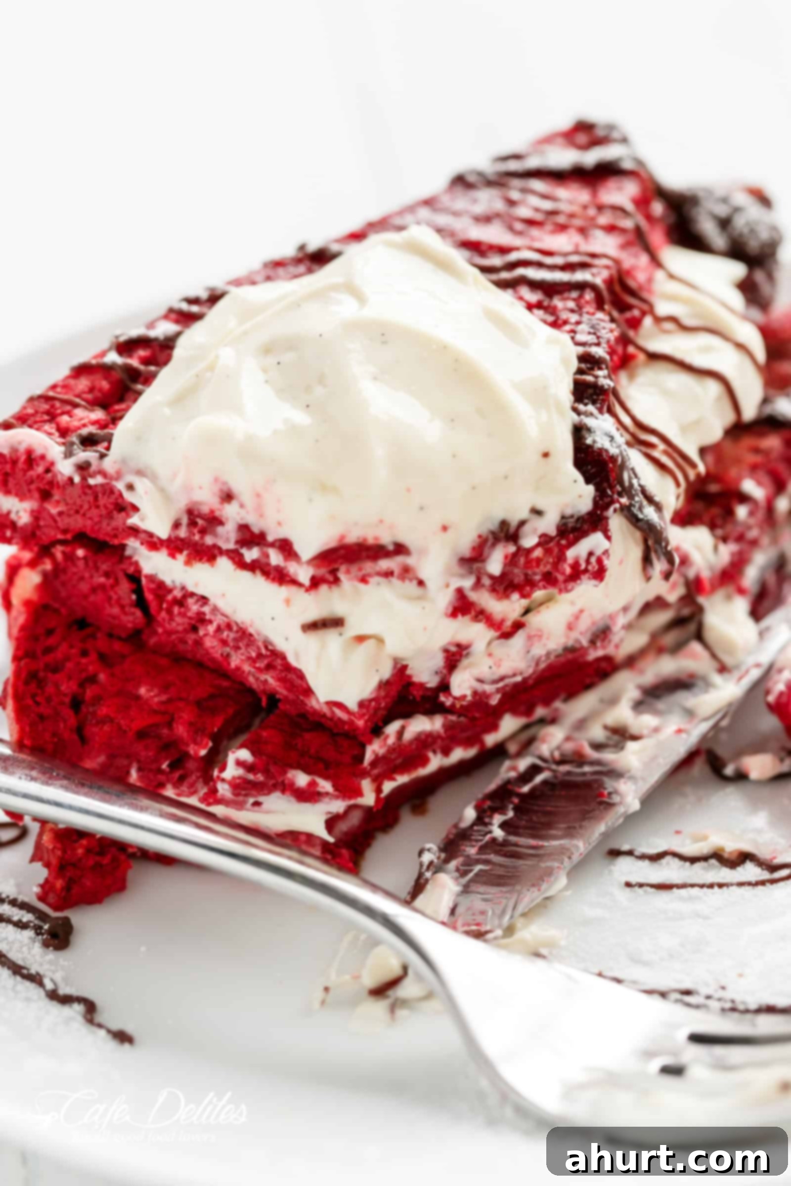 A beautifully arranged plate of Red Velvet French Toast Cheesecake sandwiches