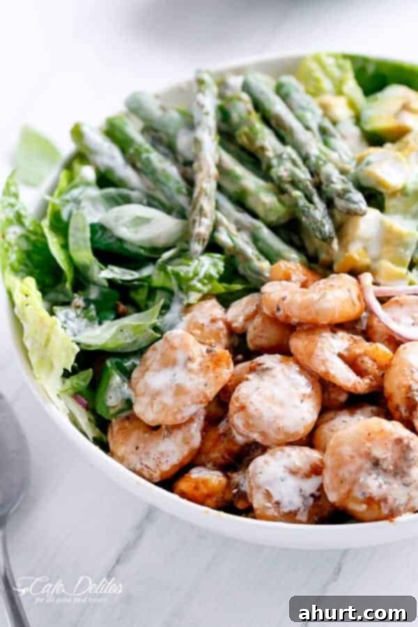 Seared Blackened Shrimp & Vibrant Green Salad 5 A close-up shot focusing on the perfectly blackened shrimp and crisp asparagus nestled within the salad.