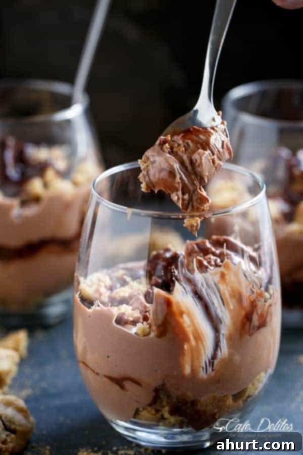 No Bake Nutella Chip Cookie Cheesecake Parfait 9 Nutella Cheesecake Chocolate Chip Cookie Parfait with a spoon