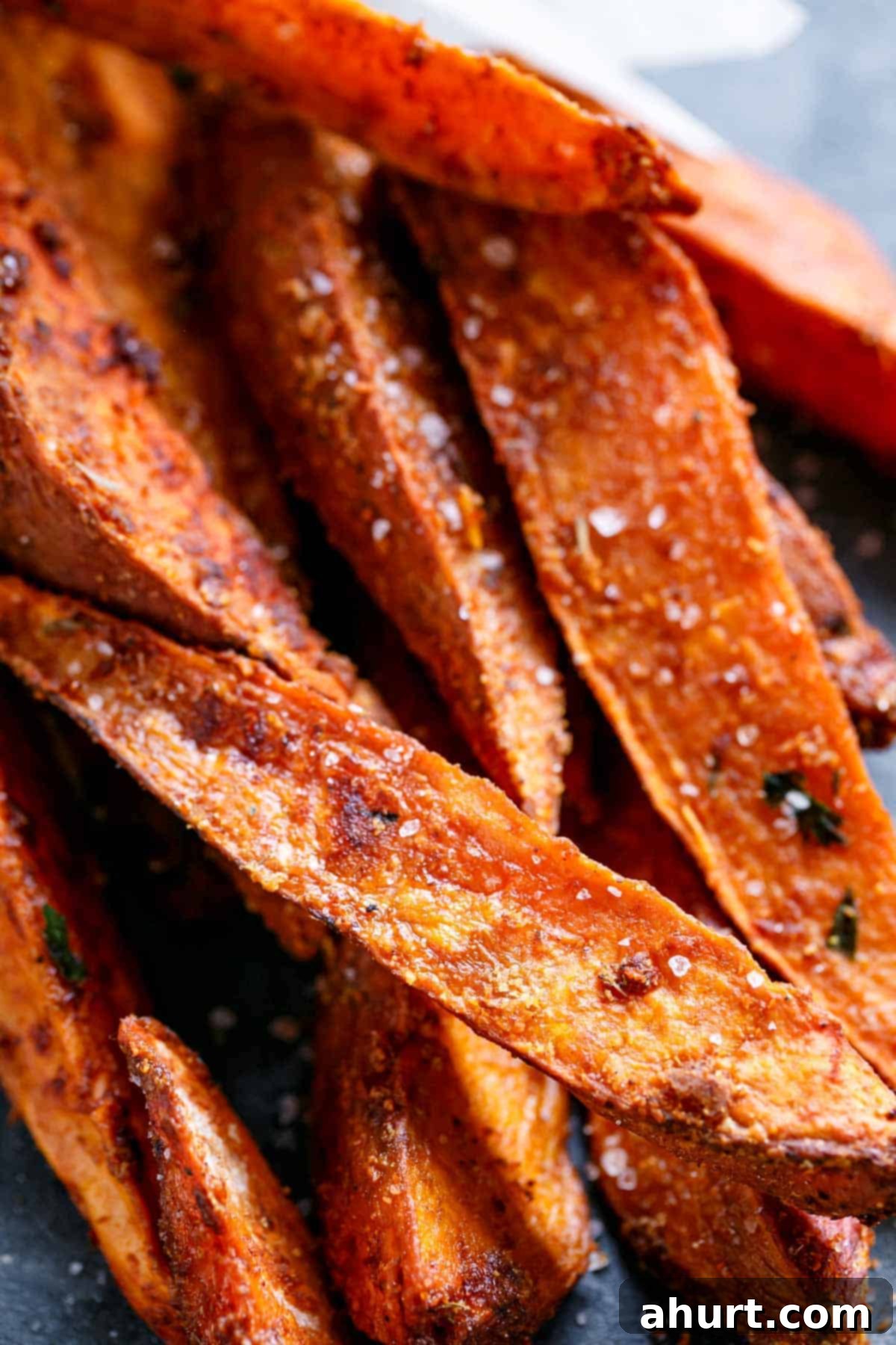 Golden Crispy Sweet Potato Wedges with Creamy Garlic Avocado Aioli 2 Zoom in image of Crispy Sweet Potato Wedges with Garlic Avocado Aioli, perfectly golden and seasoned.
