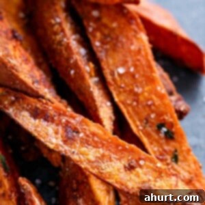 Golden Crispy Sweet Potato Wedges with Creamy Garlic Avocado Aioli 13 Crispy Sweet Potato Wedges with Garlic Avocado Aioli, a perfect golden-brown side dish.