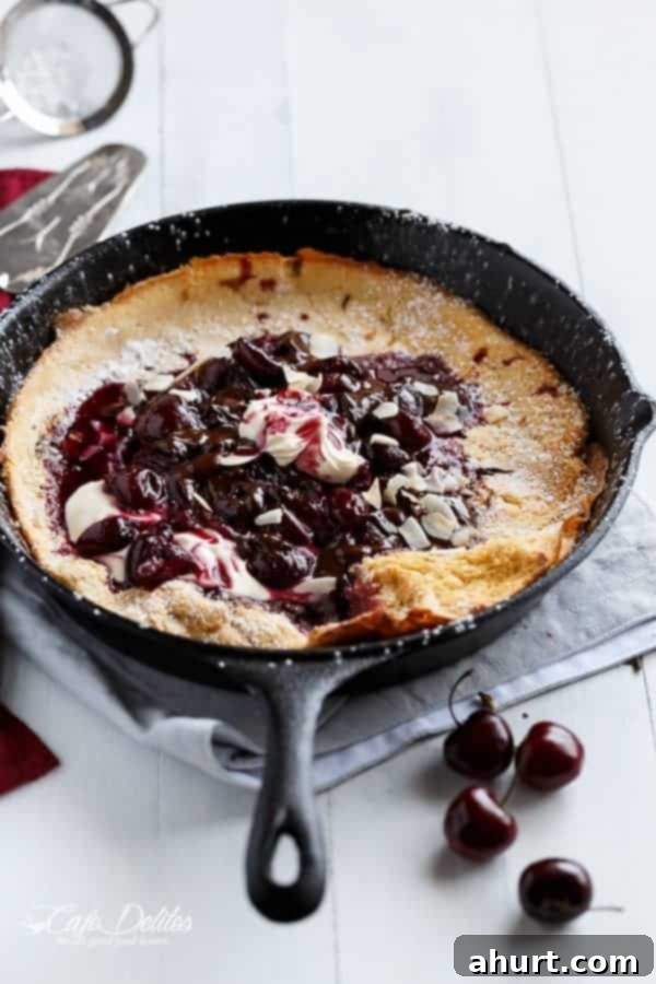 Toasted Butter Chocolate-Cherry Sky-High Pancake 2 Chocolate-Cherry German Pancake (or Dutch Baby Pancake) on a pan