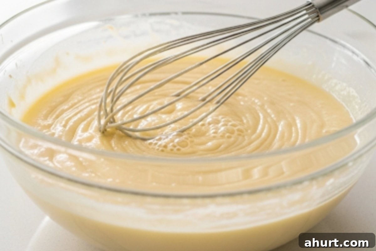 Golden Churro Molten Delights 7 Whisk flour, sugar, salt, baking powder, melted butter, egg, vanilla and milk until smooth.
