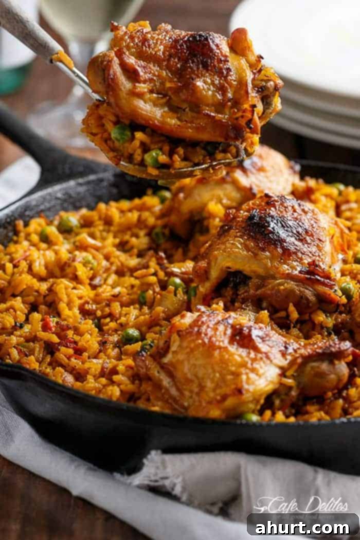 An image focusing on the chicken piece from One Pan Crispy Spanish Chicken and Rice 