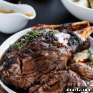 Roasted Lamb with Sundried Tomato and Garlic 8 Sundried Tomato and Garlic Roast Lamb on a plate, ready to be served