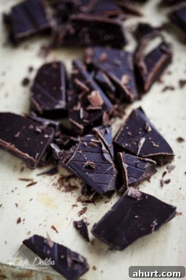 Fudgy Keto Zucchini Brownies 5 High-quality dark chocolate pieces ready to be added to Low Carb Zucchini Brownies for rich flavor.