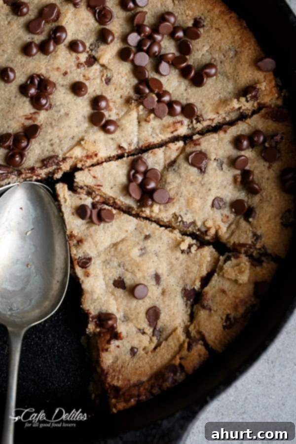 Delicious Low Carb Browned Butter Chocolate Chip Skillet Cookie with melted chocolate chips on top, served in a cast iron skillet.