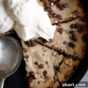 Keto Brown Butter Chocolate Chip Skillet Delight 7 A scoop of vanilla ice cream melting gloriously on top of a warm Low Carb Browned Butter Chocolate Chip Skillet Cookie.
