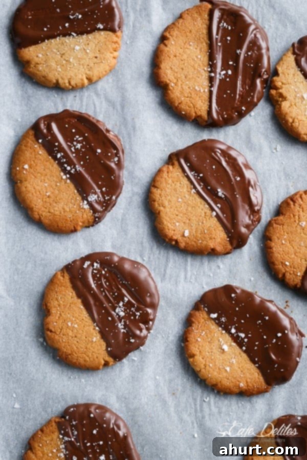 Salted Chocolate Dipped Peanut Butter Cookies on a baking tray, ready to be enjoyed