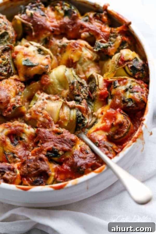 Spinach and Ricotta Zucchini Cannelloni with spoon in a bowl